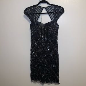 Black sequin and silver beaded dress.